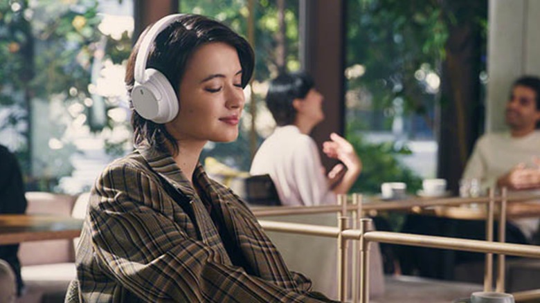 wpman listening to music on Sony headphones