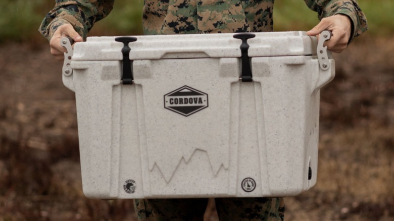 man holding a cordova cooler