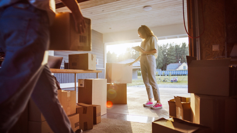 People inspecting the items in their garage