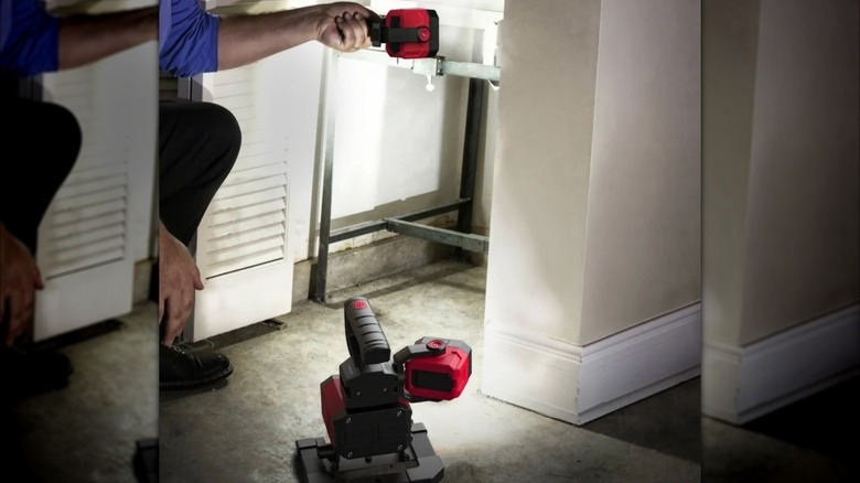 person using separated LED worklight