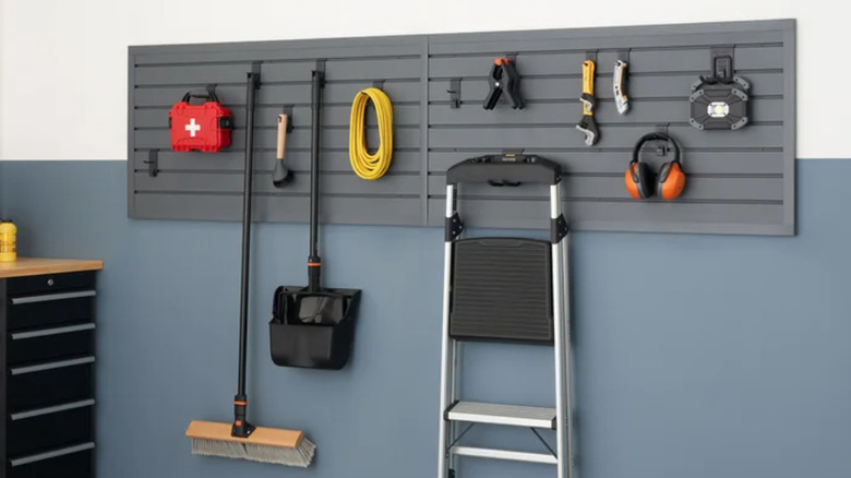 Trinity modular slatwall in garage with equipment hanging