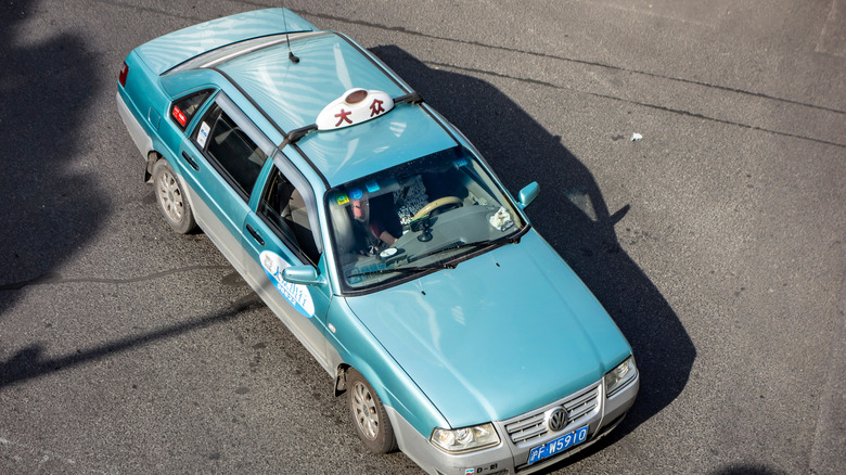Aerial view of a teal Volkswagen Santana in China.