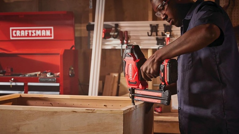 DIYer using a Craftsman V20 brad nailer