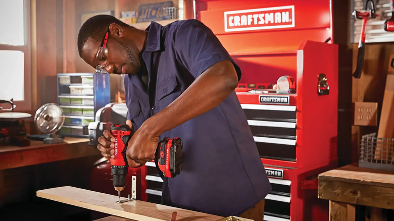 DIYer using a Craftsman V20 1/2 inch drill