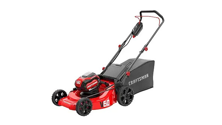 Red and black cordless lawn mower with a white background