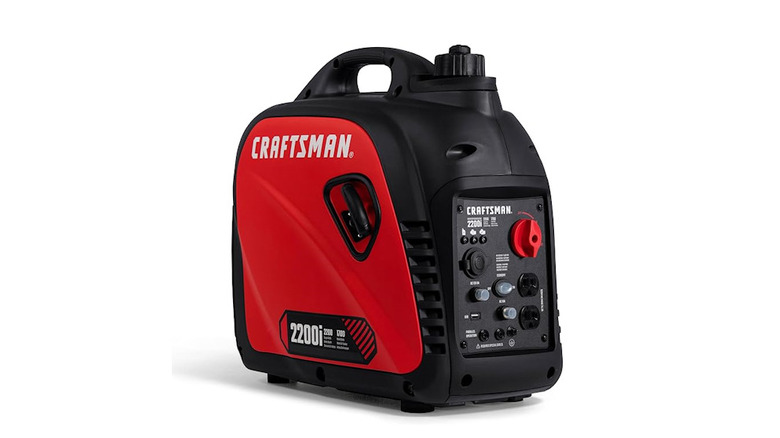 Red and black portable generator with a white background