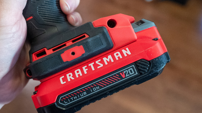 Red and black drill battery with a white Craftsman logo