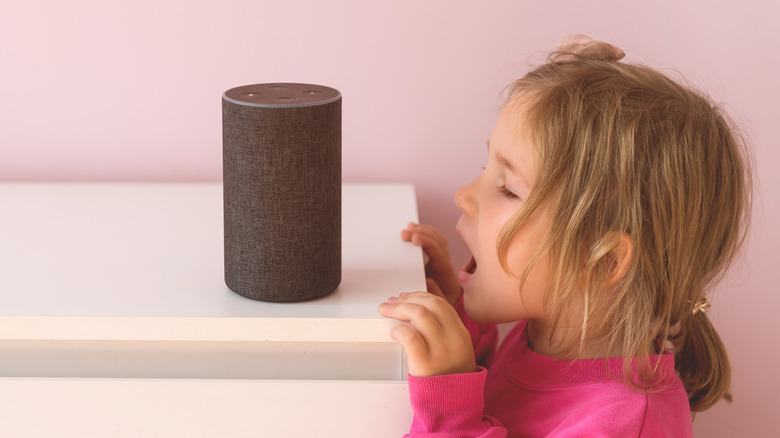 Little girl talking to an Amazon Alexa Echo device