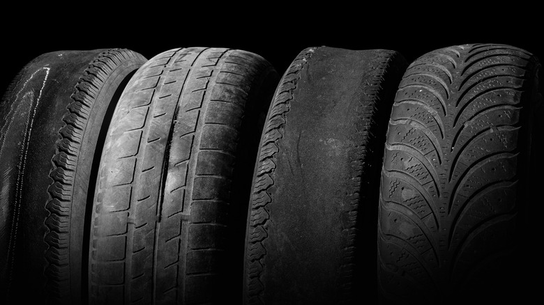 Four tires showing different states of wear.