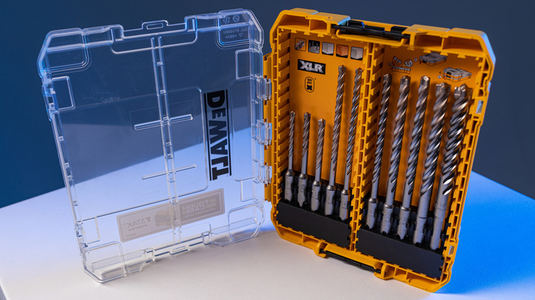 An open DeWalt case with a transparent lid carrying drill bits.