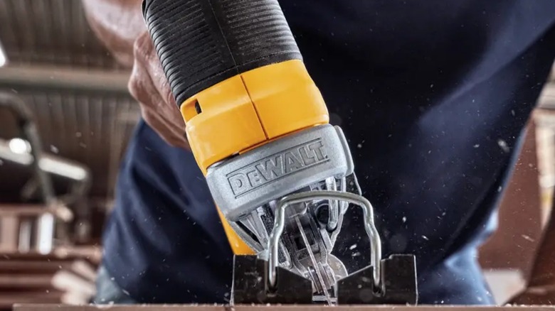 Close up of person cutting wood with DeWalt 20V Max XR Brushless Jigsaw