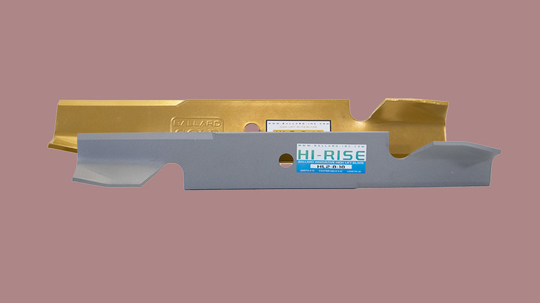 A pair of high lift lawn mower blades against a red background