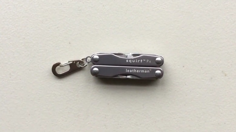The Leatherman Squirt P4 closed on a plain surface.