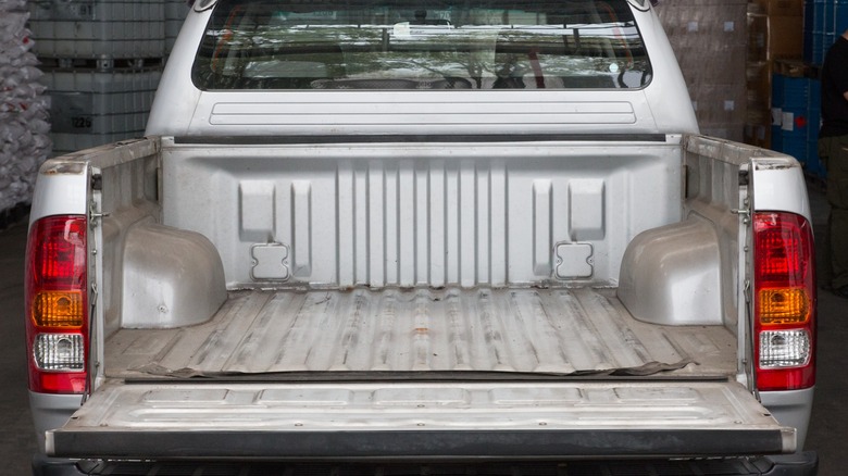View into a silver pickup truck bed