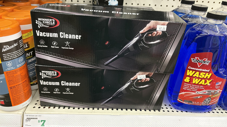 Store display of two handheld vacuum cleaner boxes stacked together