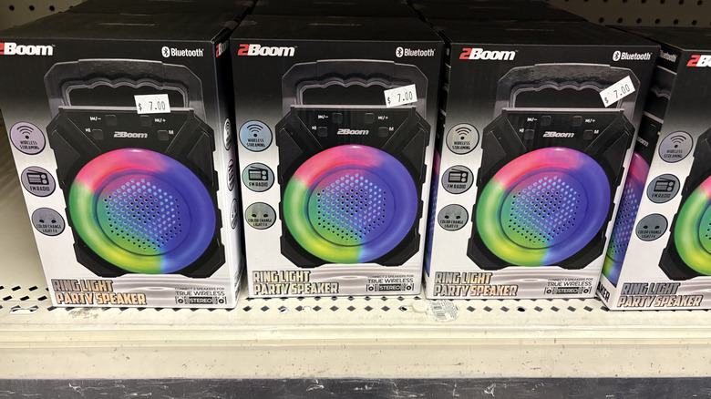 Store display of three lighted speakers in a row