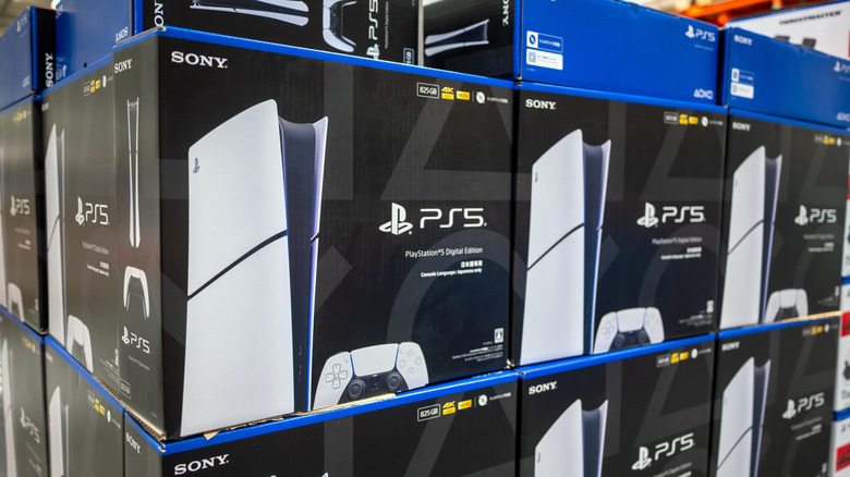 Stacks of PS5 boxes in a store.