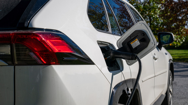 A close-up of a Toyota RAV4's charge port while charging.