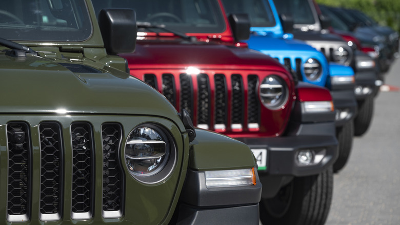 A row of multiple Jeep Wranglers parked next to each other.