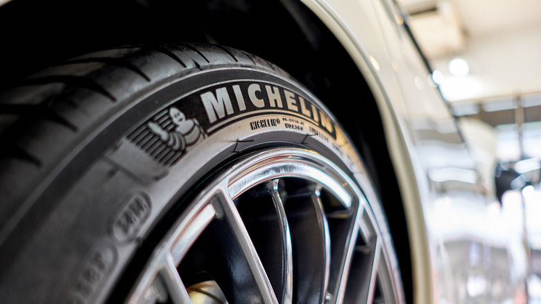 A close-up of a mounted Michelin tire on a car.