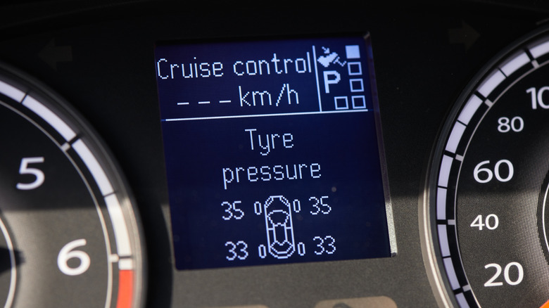 A close-up of a car's dashboard screen showing TPMS readings.