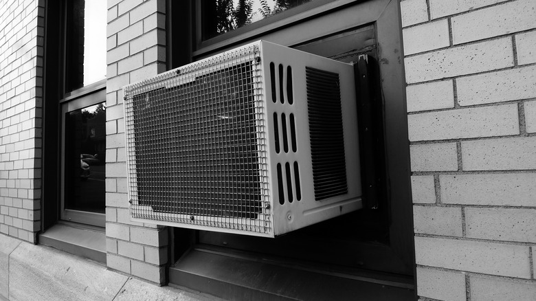 backside of window AC in brick building