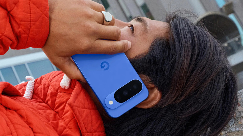 A person talking on their Google Pixel phone while lying down