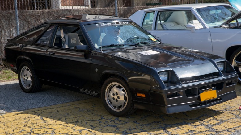 a black Dodge Shelby Charger GHLS