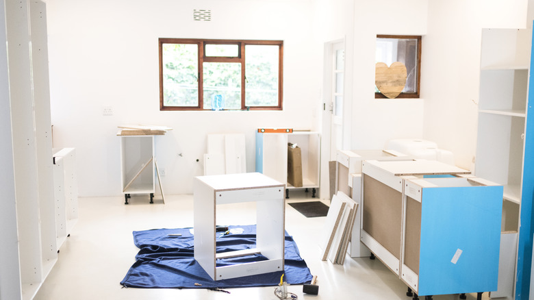 Cabinetry being assembled in a kitchen.