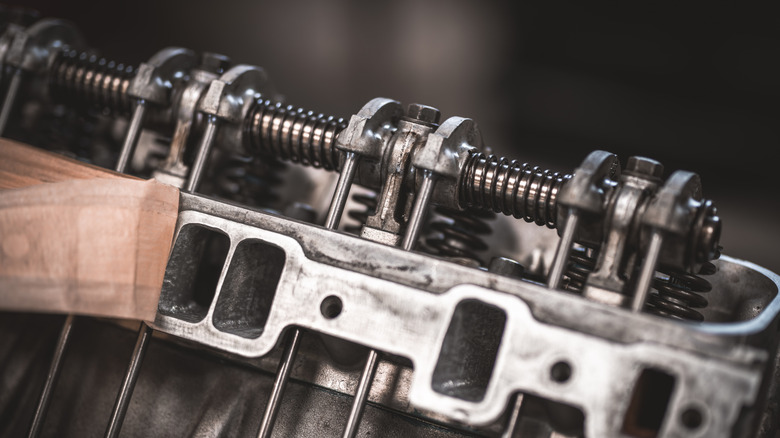 Detail view of pushrod engine head showing pushrods and rocker arms