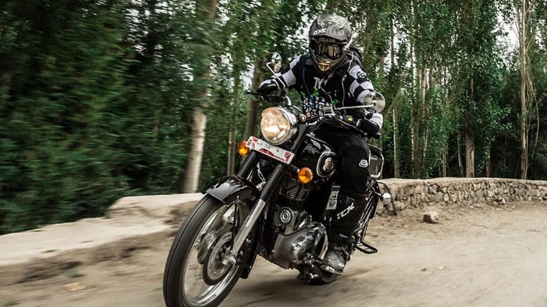 Rider on Royal Enfield Bullet 500 on dirt trail