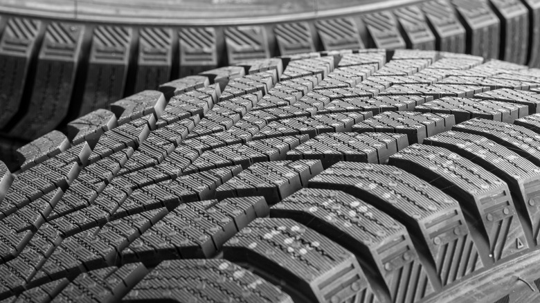 A close-up of a directional tire groove pattern.