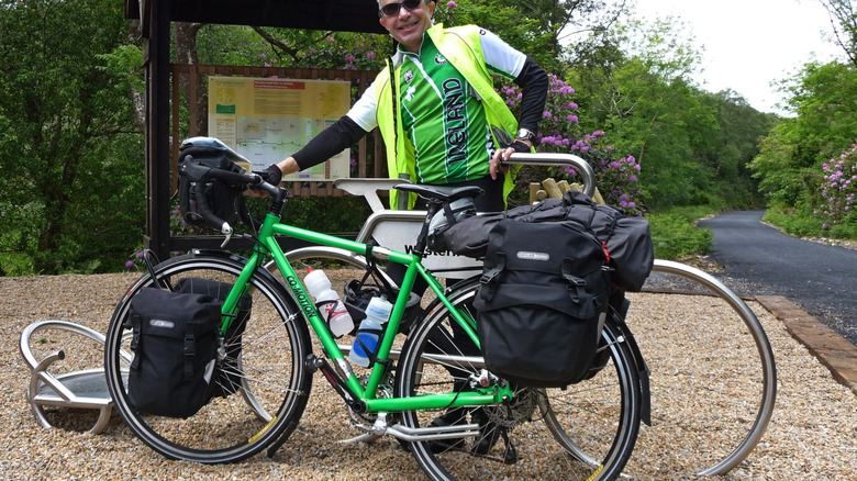 man standing by a co-motion cycles ebike