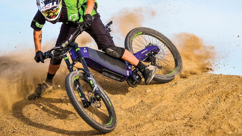 man riding HPC ebike on dirt