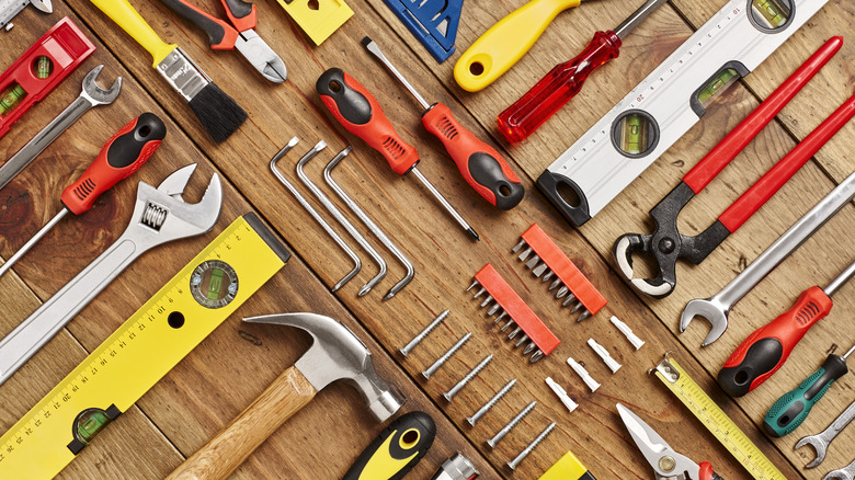 various tools laid out on wood