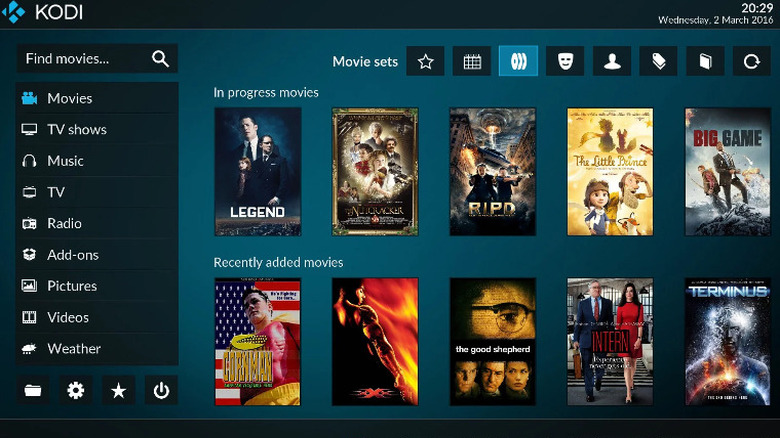 The Kodi home page, many movie posters in the center.