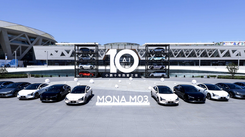 A lineup of the XPENG MO3 AI vehicles outside a gigafactory