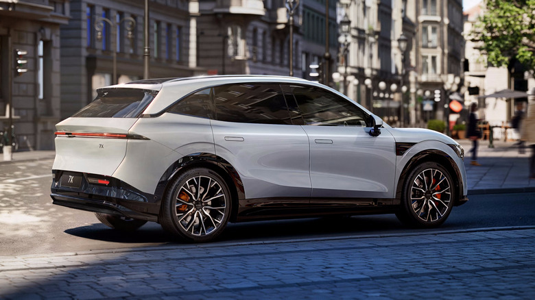 A slate grey Zeekr 7X EV SUV parked in the shade, rear-right view visible