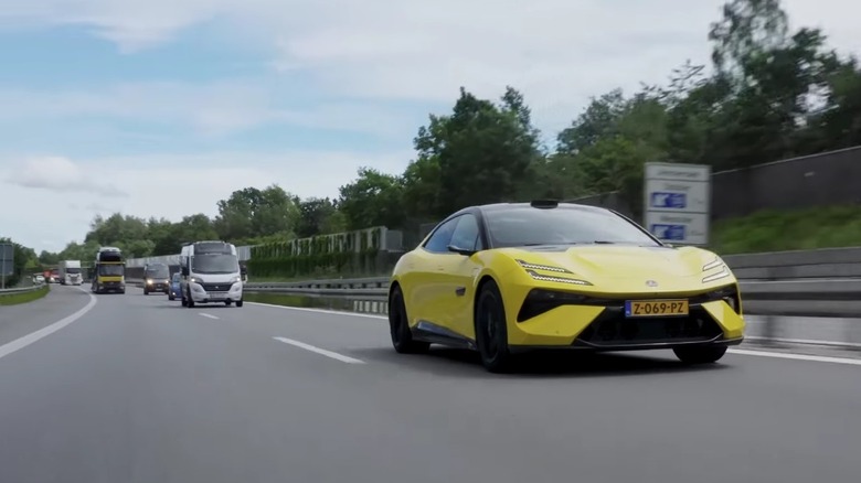 Lotus Emeya R driving on the road.