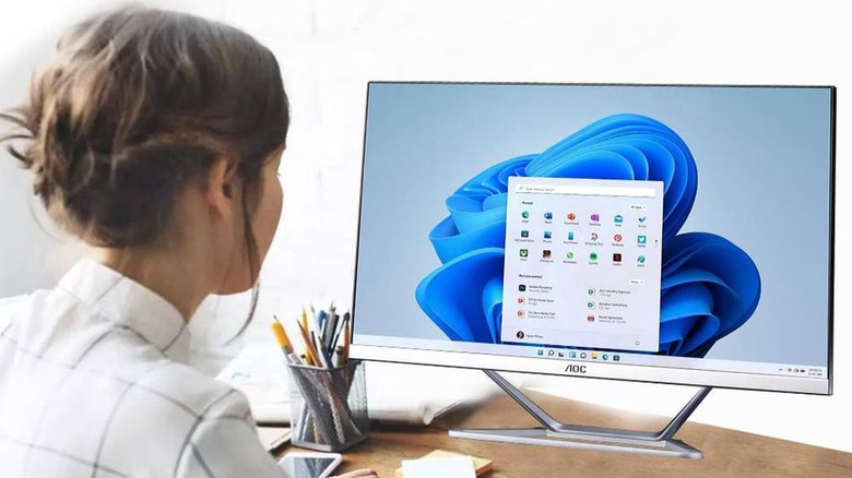 Person using the AOC 23.8 all in one desktop computer