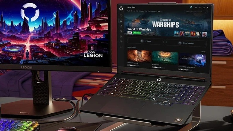 A Lenovo Legion 5 series laptop next to a monitor.