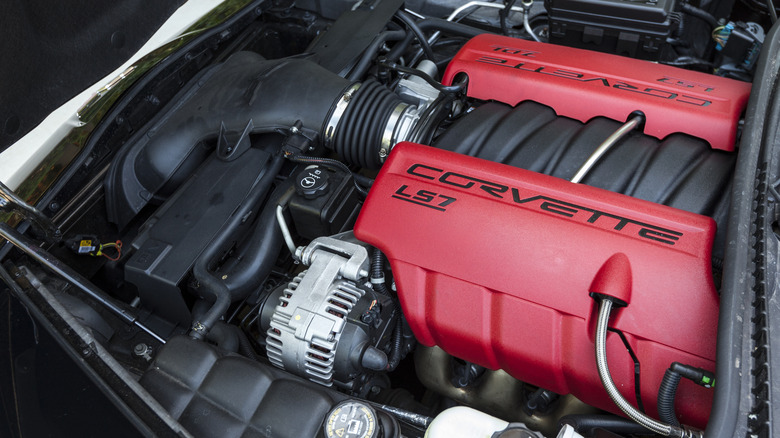 A close-up of a Chevrolet Corvette engine bay featuring the LS7 engine.