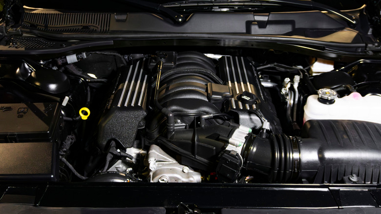 A close-up of a Dodge Challenger 6.4 SRT Scat Pack engine.