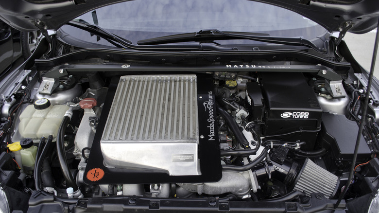 A modified Mazda MZR 2.3 turbo engine under the hood of a Mazdaspeed3