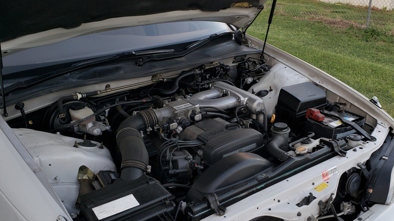 A stock 1JZ engine under the hood of a Toyota Mark II