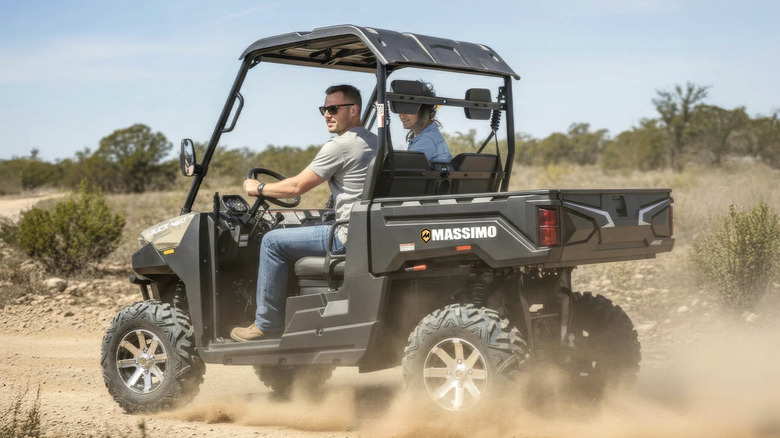 Person driving a Massimo UTV in the desert