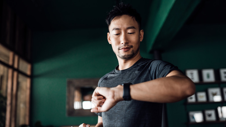 man using smartwatch