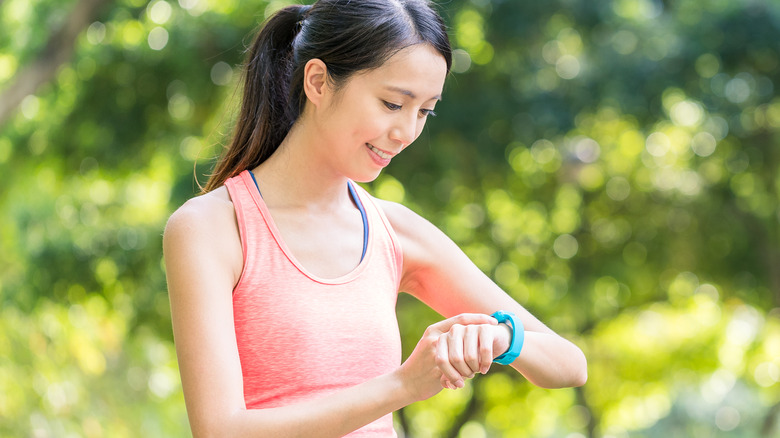 woman using apple watch