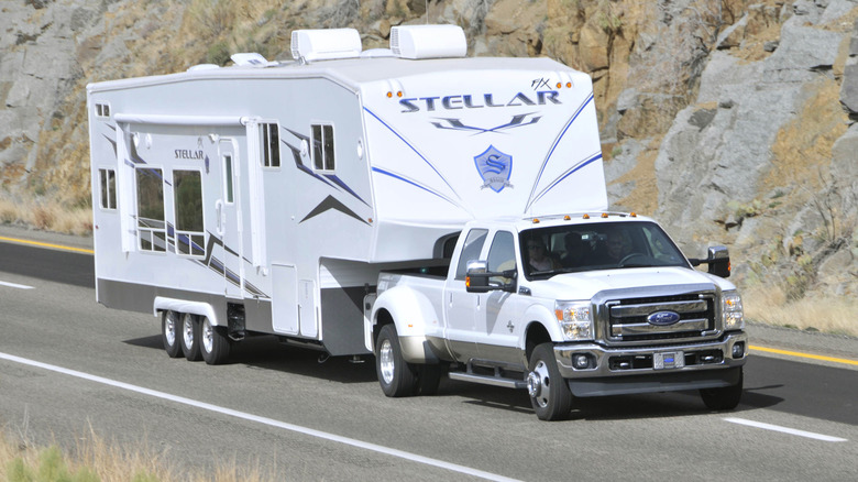 Ford F350 diesel truck pulling trailer