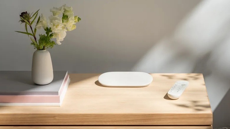 A Google TV Streamer with its remote it on top of a table